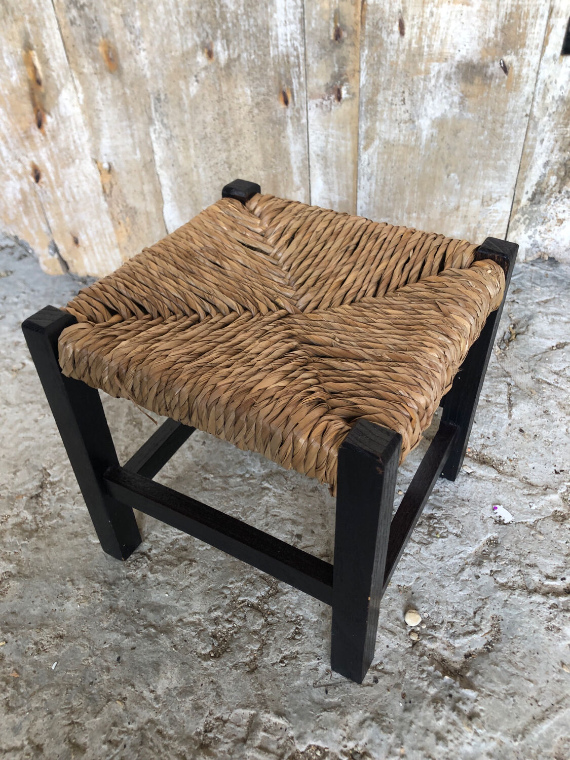 Black wood foot rest stool & vintage mulched seat