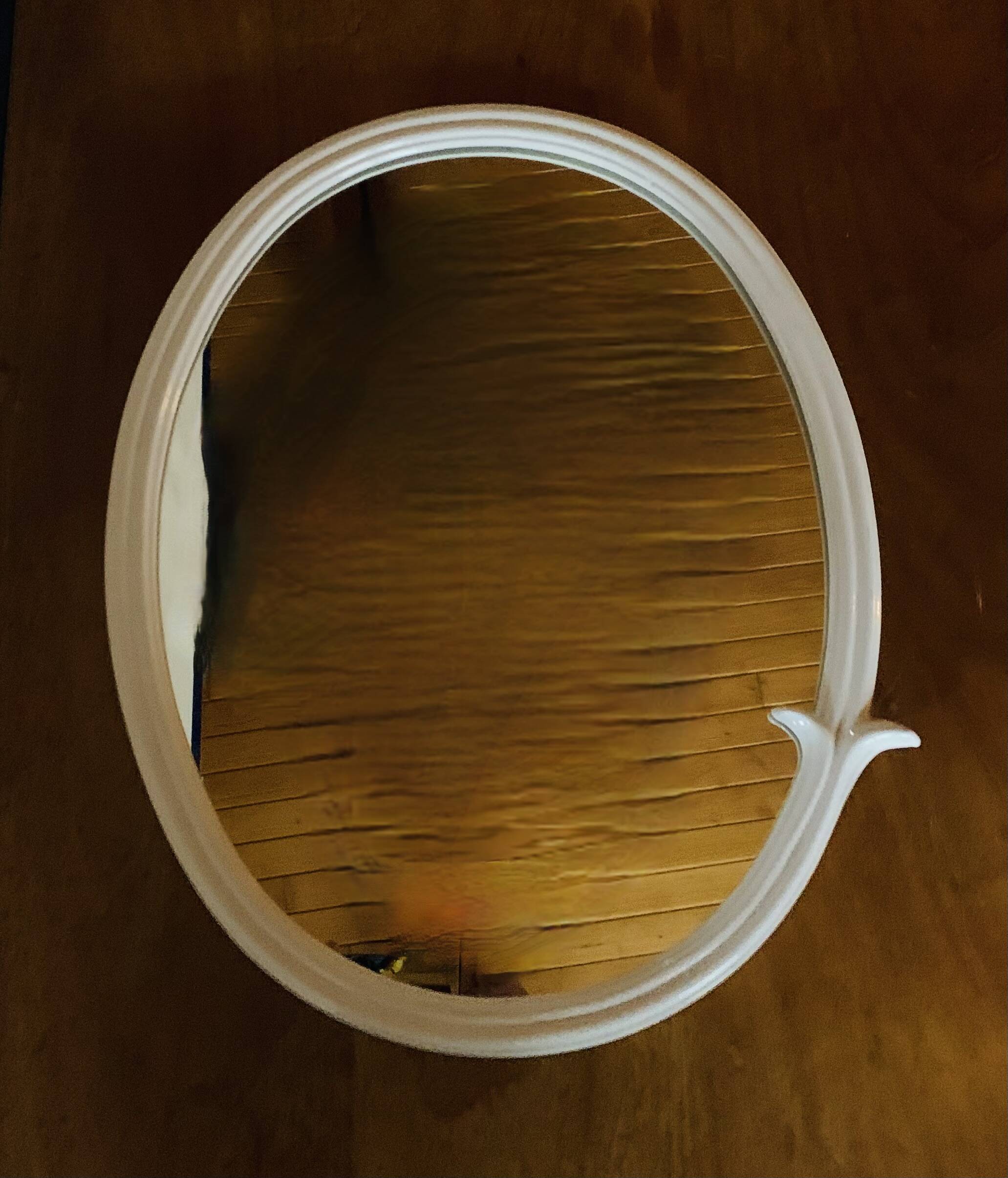 Oval mirror in vintage enameled white cast iron