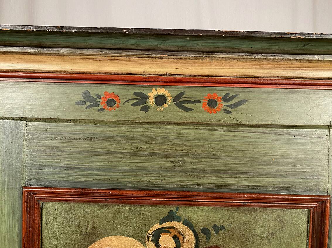 Alsatian bonnet maker in painted softwood with floral decorations