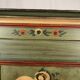 Alsatian bonnet maker in painted softwood with floral decorations
