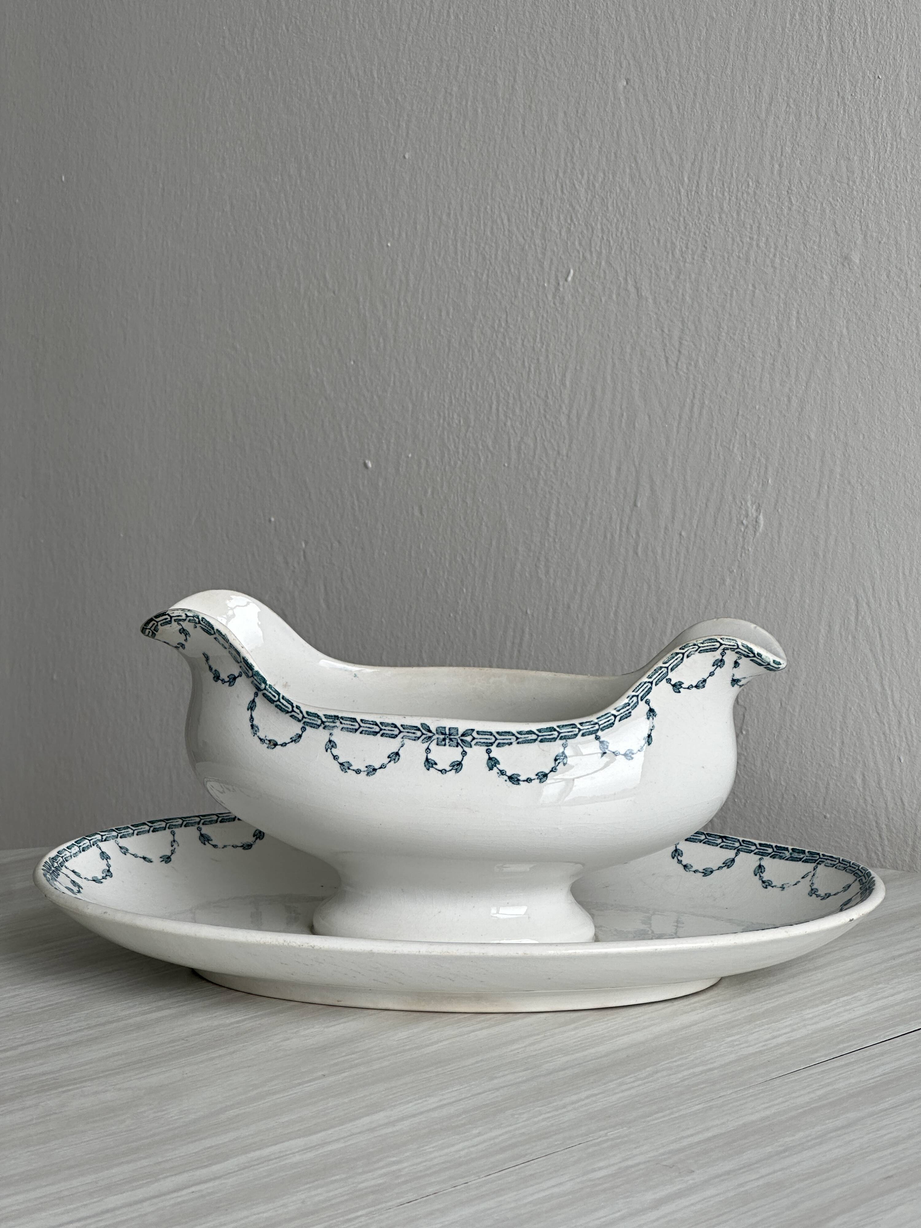 Antique porcelain sauceboat with tray