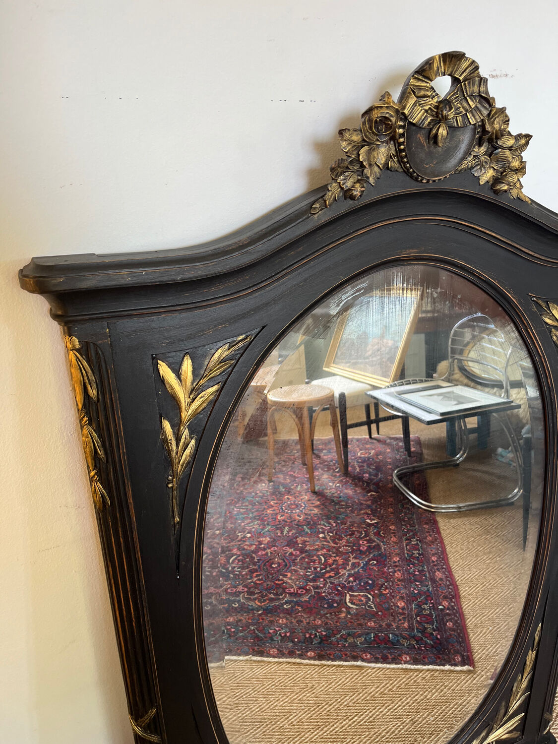 Large old trumeau mirror in black and gilded wood Napoleon style
