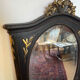 Large old trumeau mirror in black and gilded wood Napoleon style