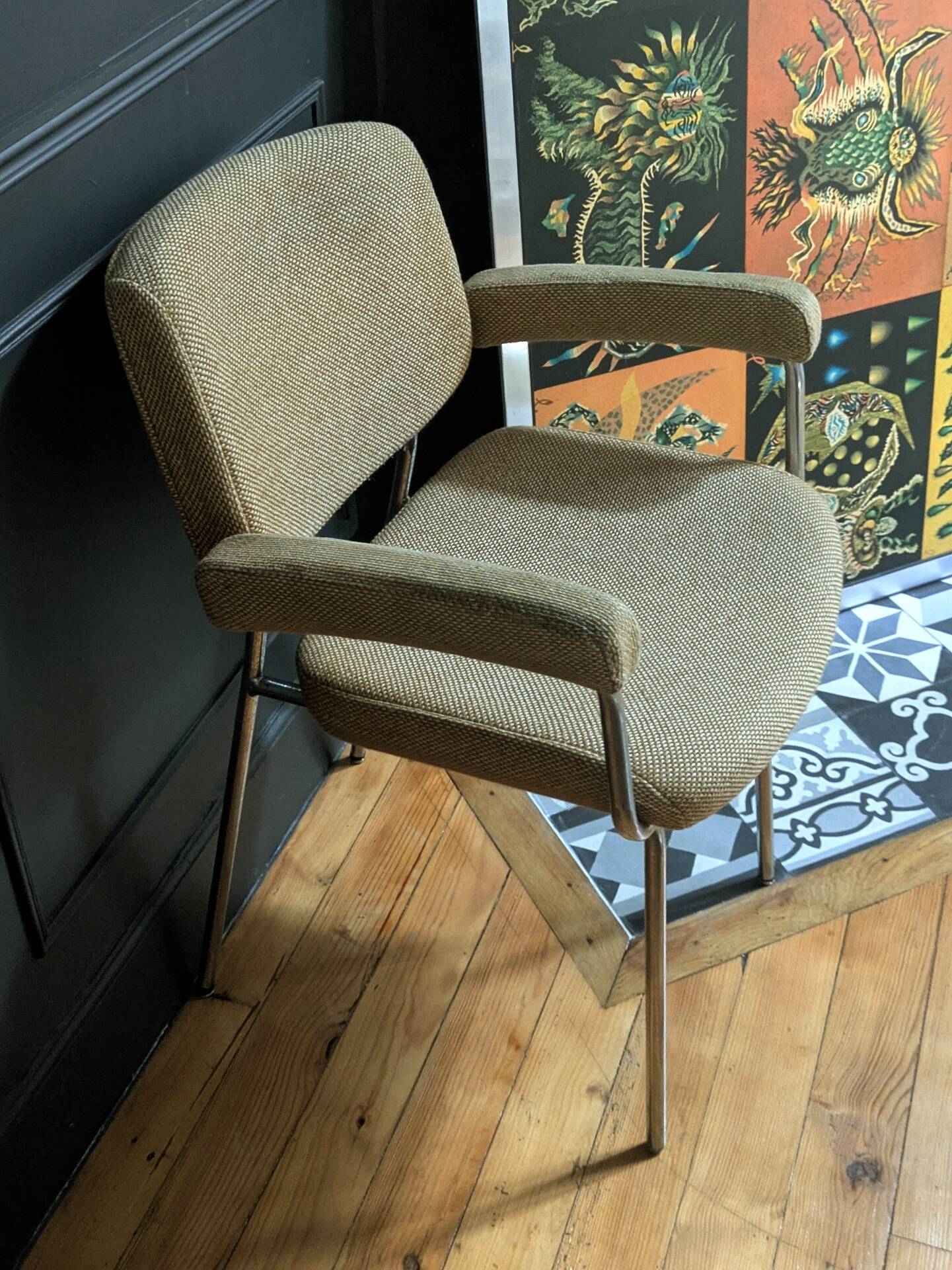 vintage tubular metal chrome office chair with patterned fabric.