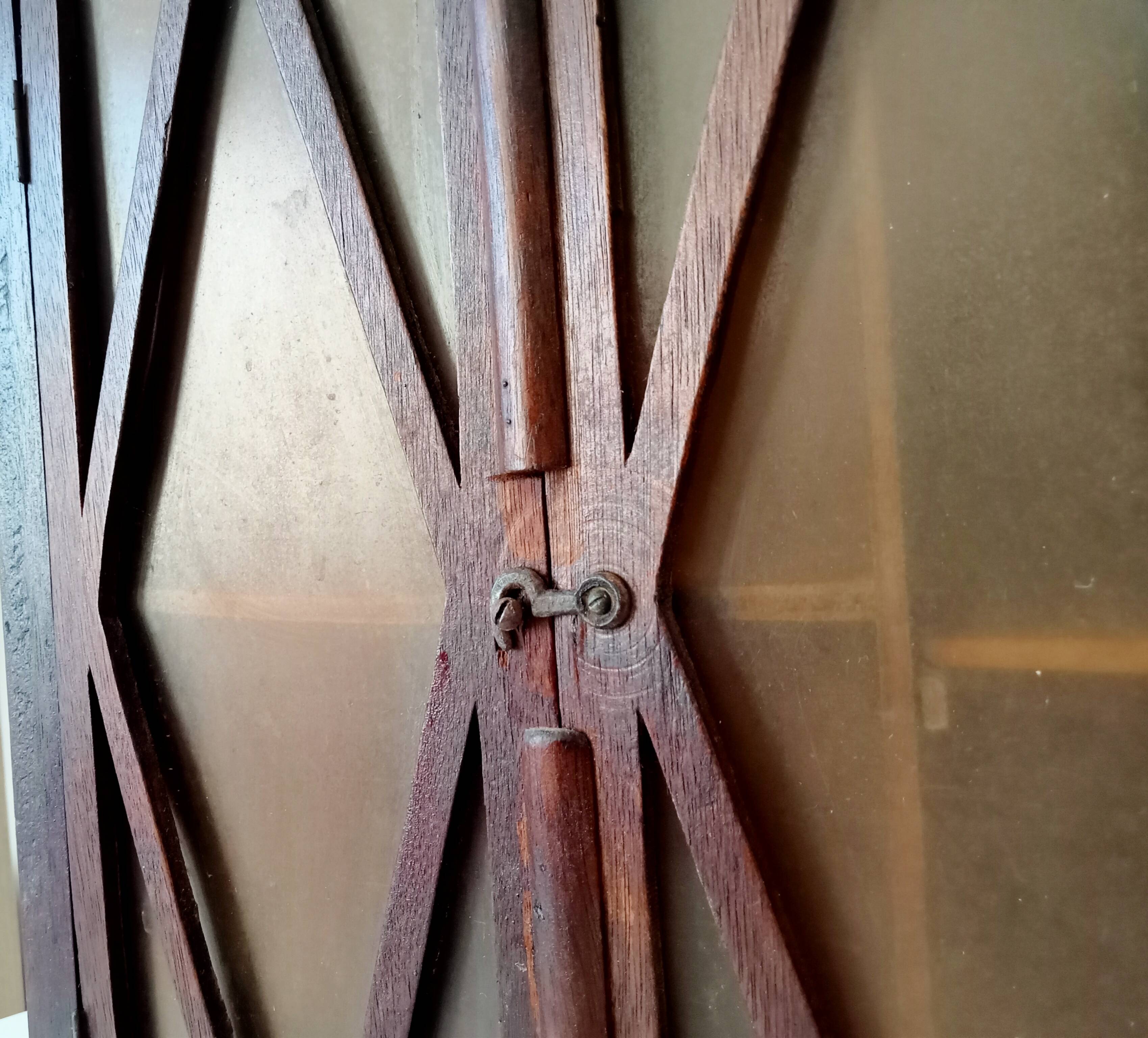 Small antique wall cabinet in Gothic style.