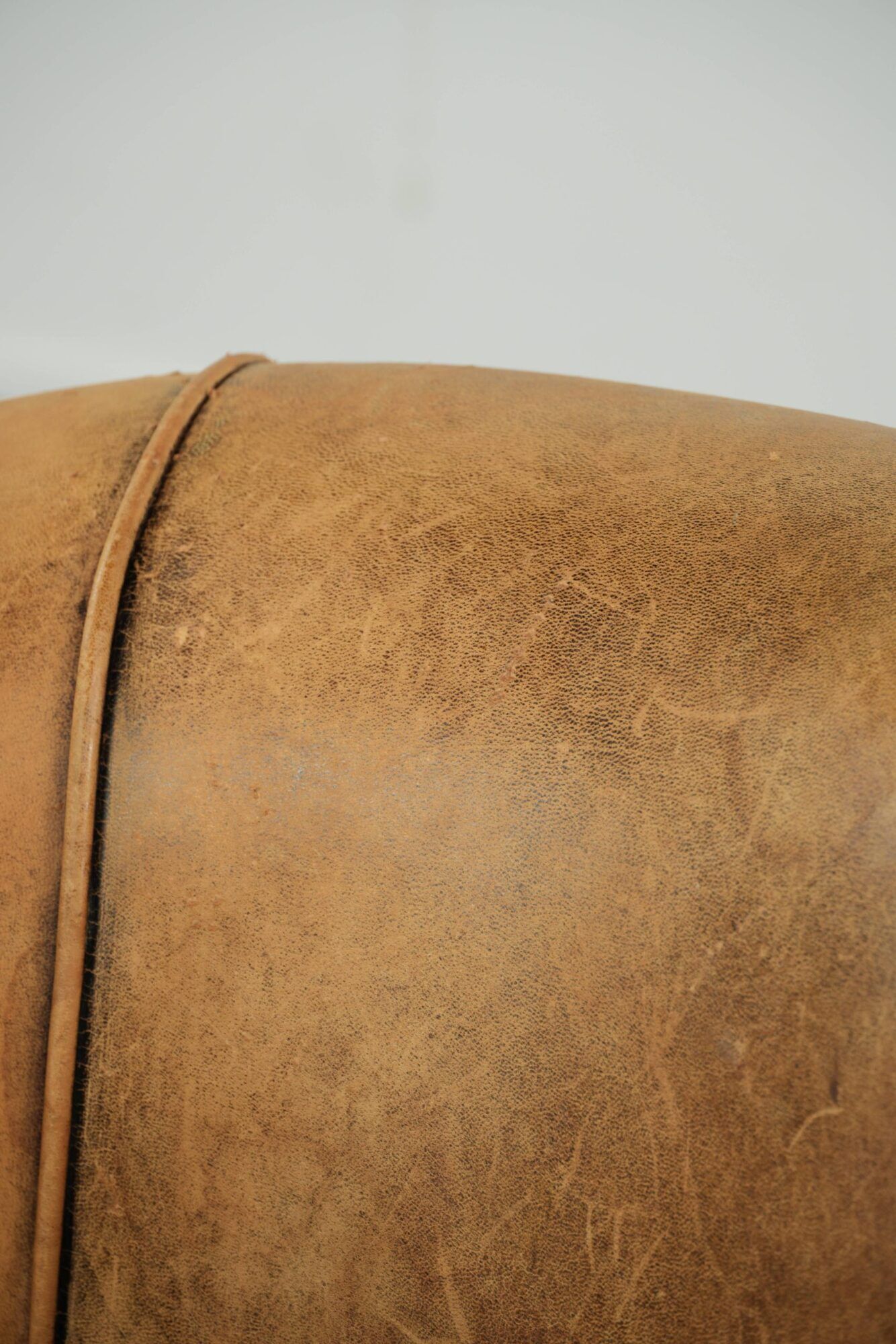 Vintage sheepskin club armchair in a light cognac colour