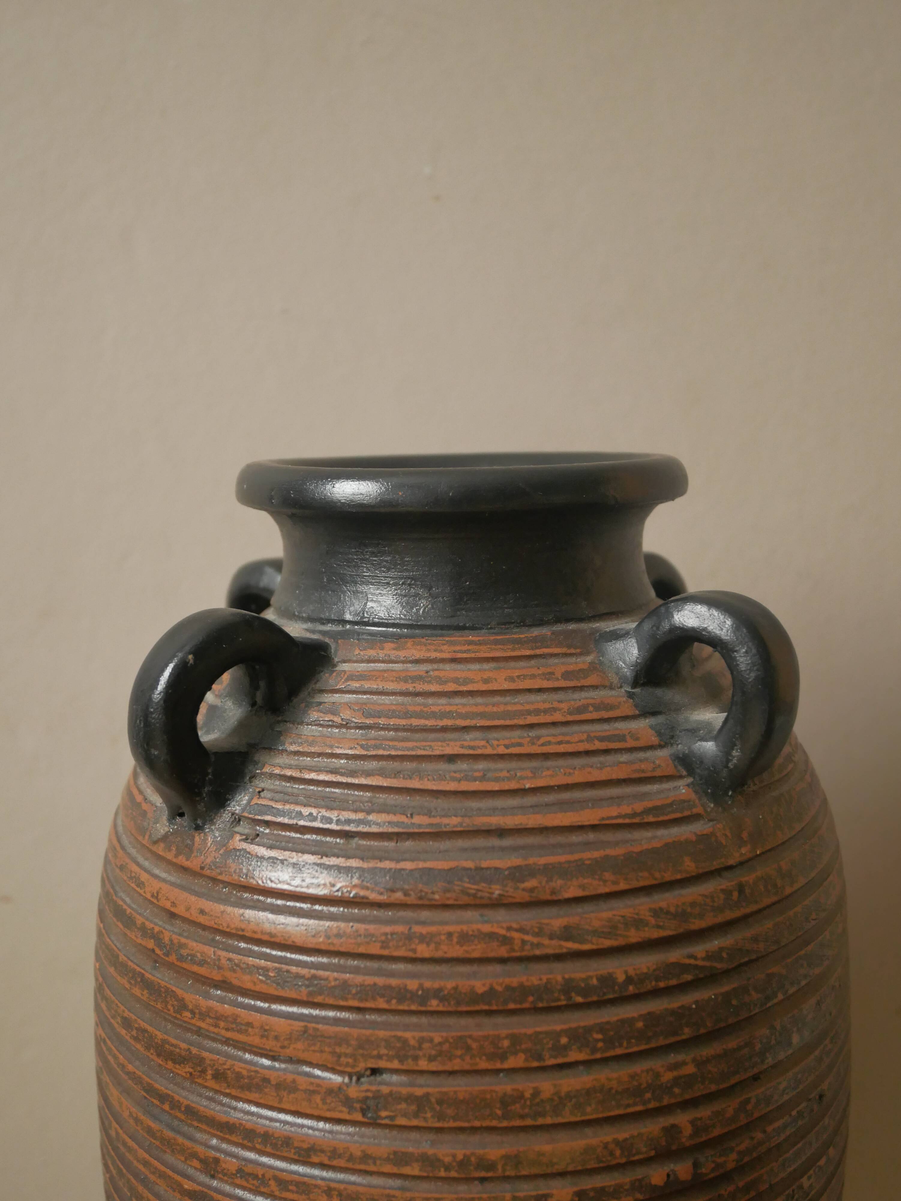 Vase with handles in vintage ceramic handmade pottery tribal ethnic decoration