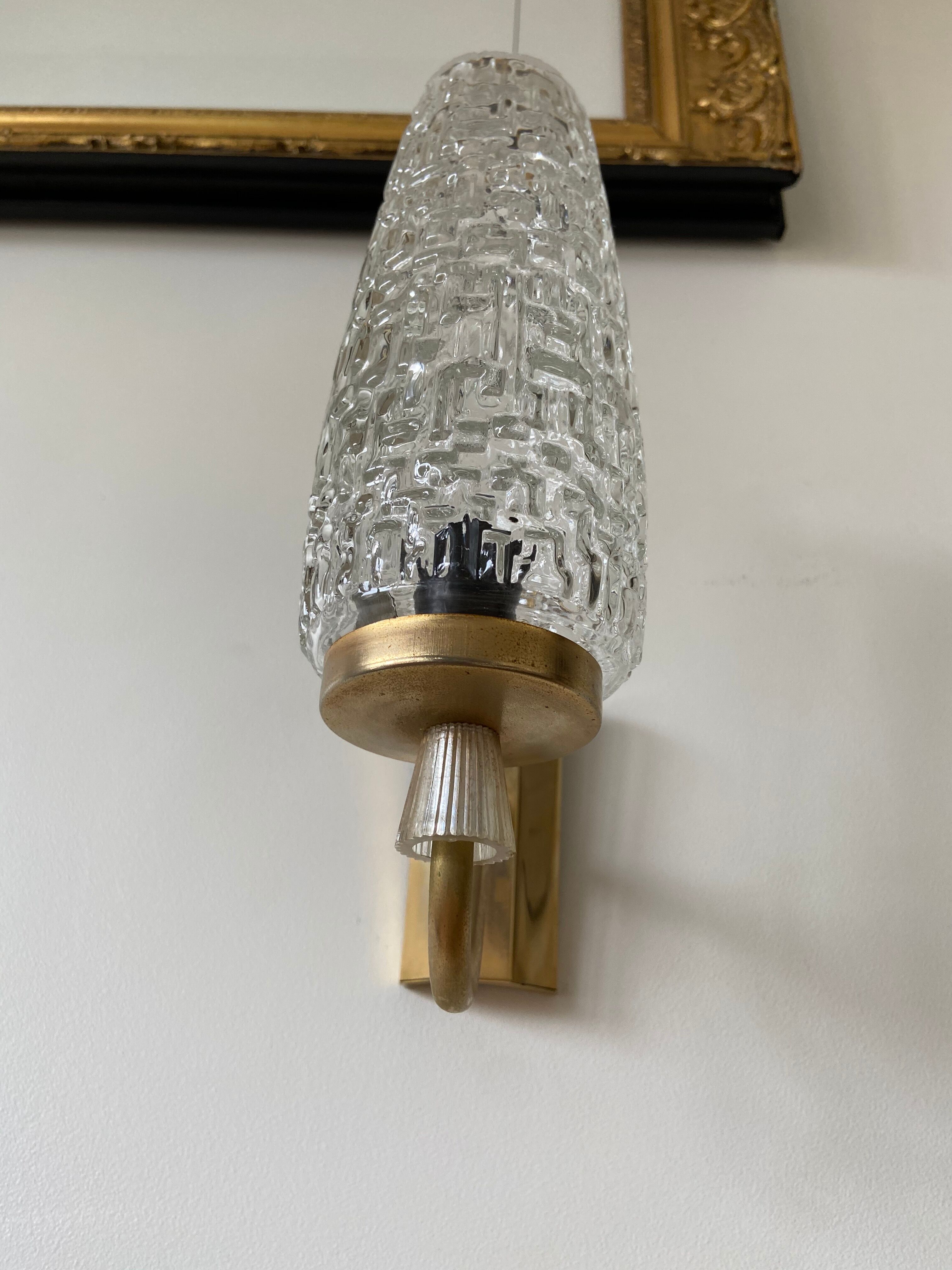 Gold metal and chiseled glass wall sconce