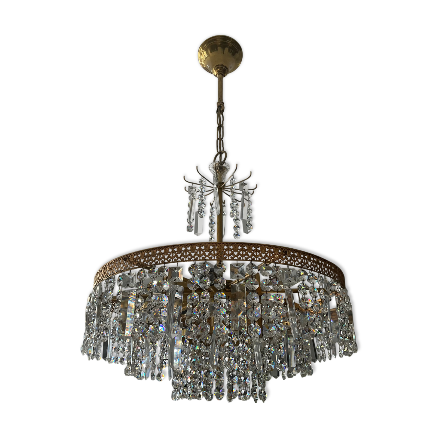 Old brass chandelier and crystal grapevines