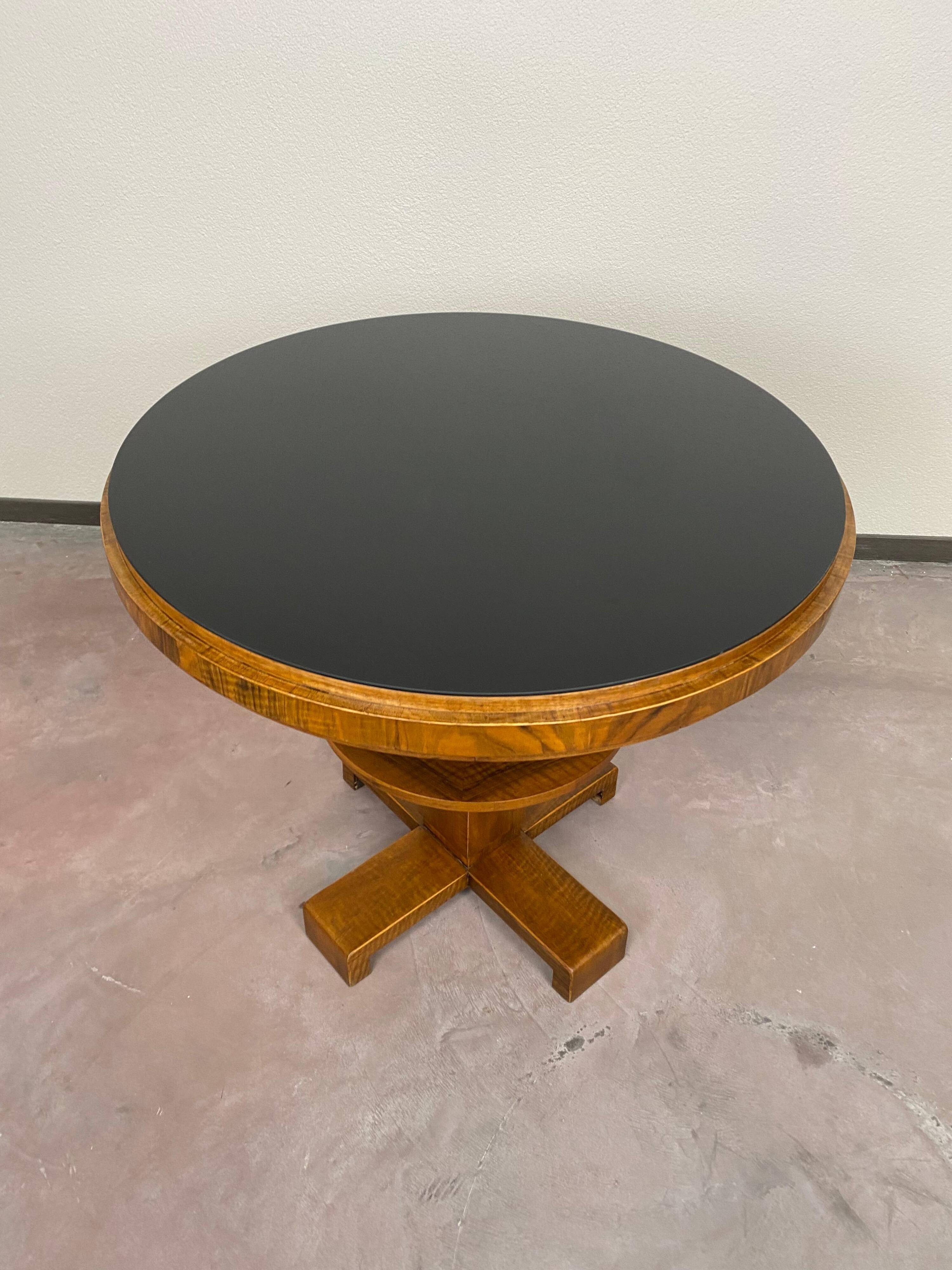 Art Deco game table with a black glass top.