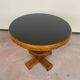 Art Deco game table with a black glass top.