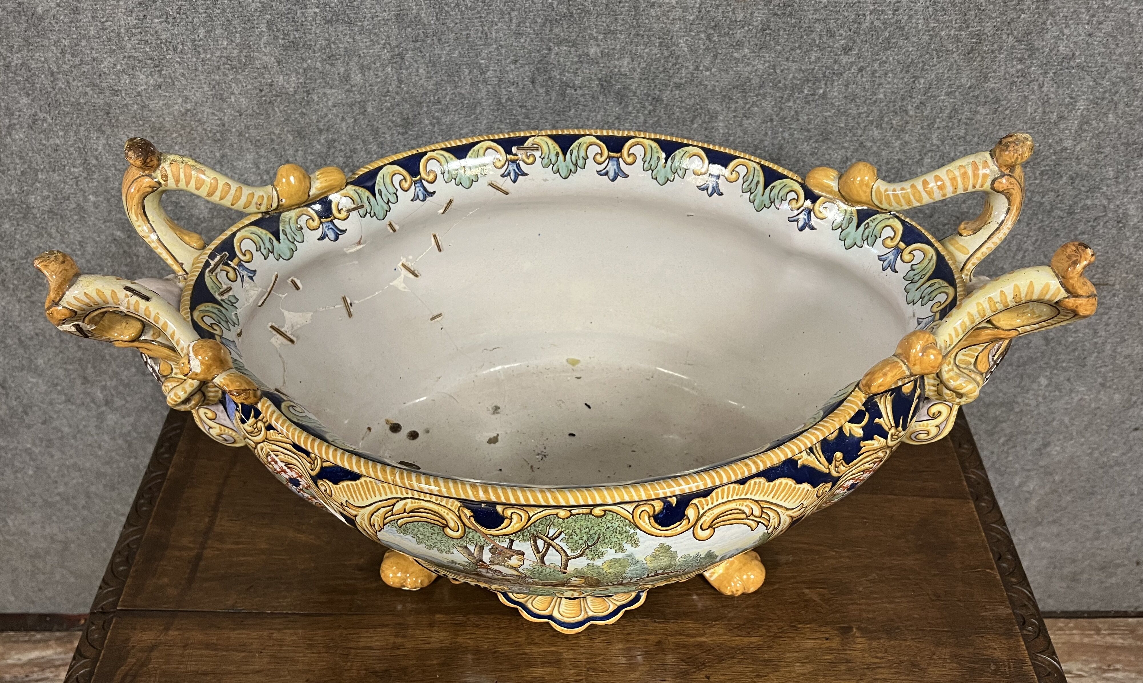 Earthenware planter with polychrome enamelled decoration on a blue background