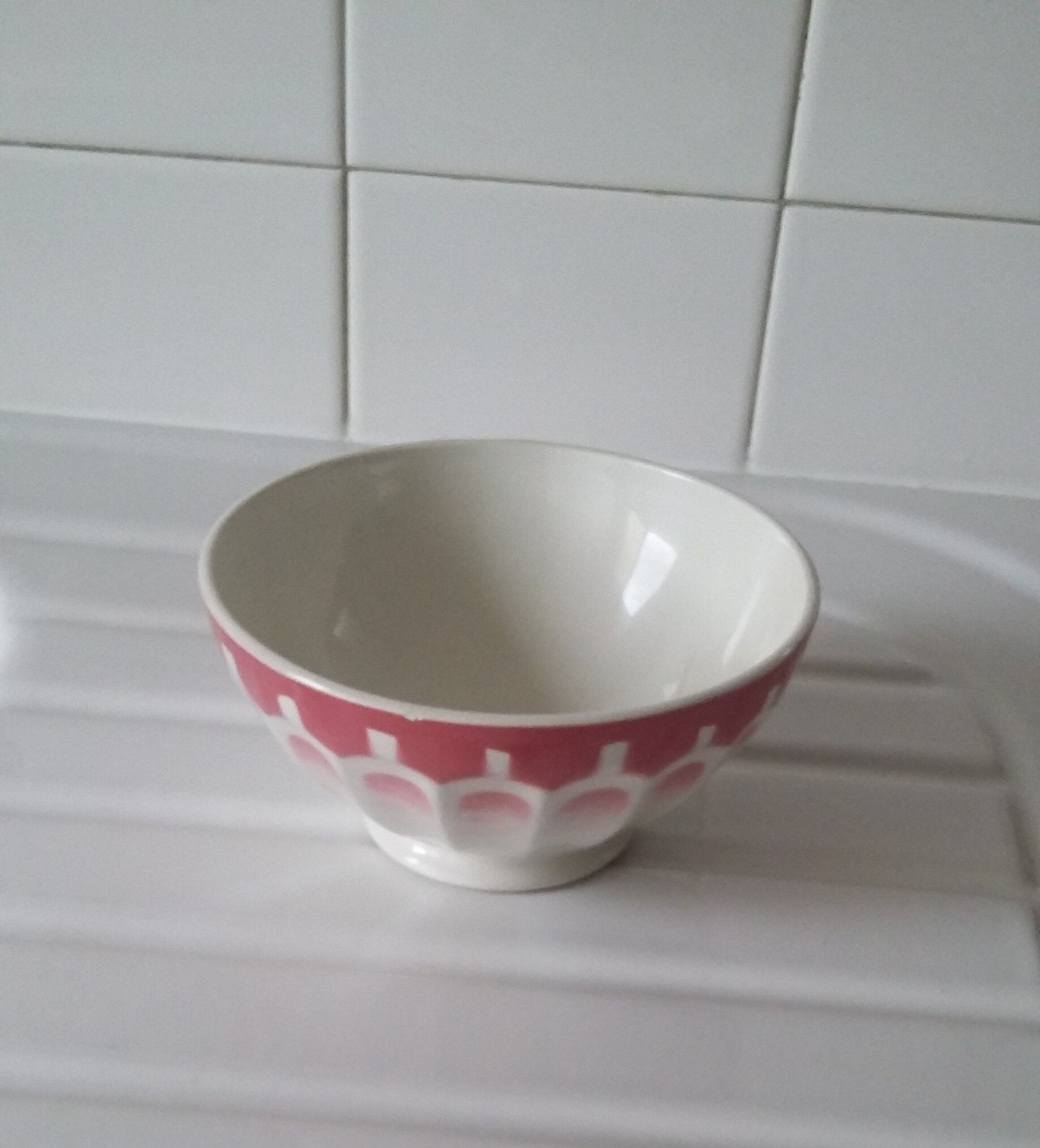 Ancient bowl in pink and white earthenware