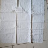 2 Pillowcases with flower decoration and satin stitch surround.