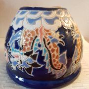 Decorative pot in multicoloured relief glazed ceramic.