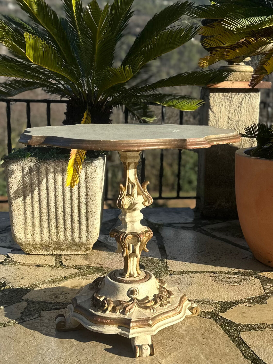 Carved and lacquered wooden side table.