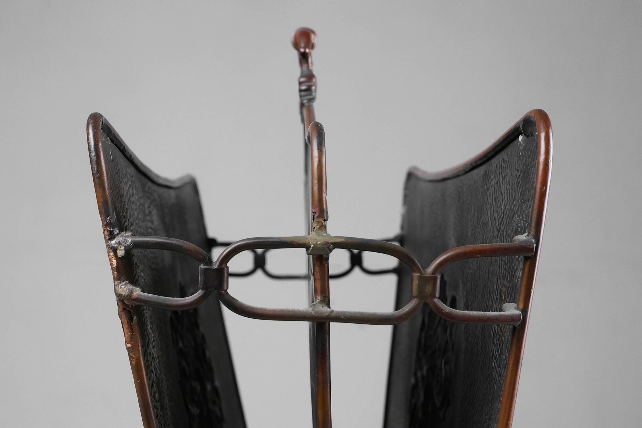 Mid-century magazine rack in hammered copper, France ca. 1900