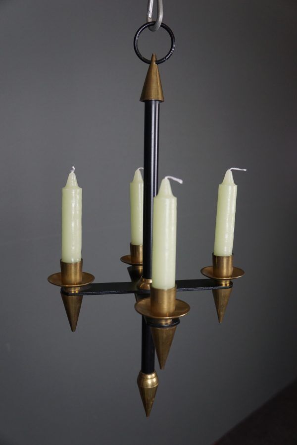 Candle holder in black metal and brass