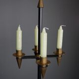 Candle holder in black metal and brass