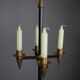 Candle holder in black metal and brass