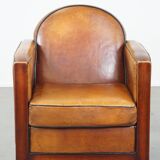 Sheep leather and wooden Art Deco design armchair with ball feet