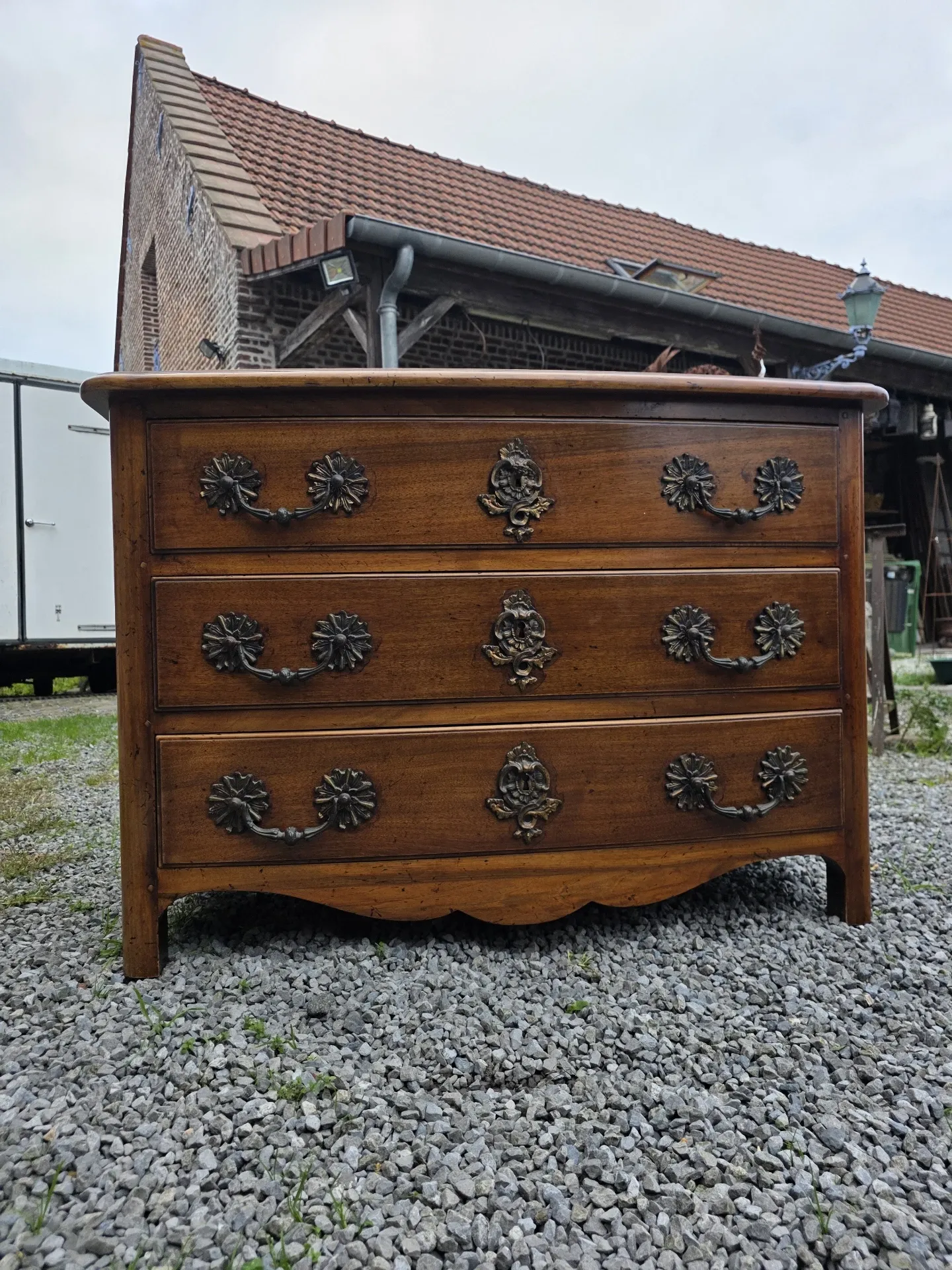 Curved Louis XV style chest of drawers in solid walnut