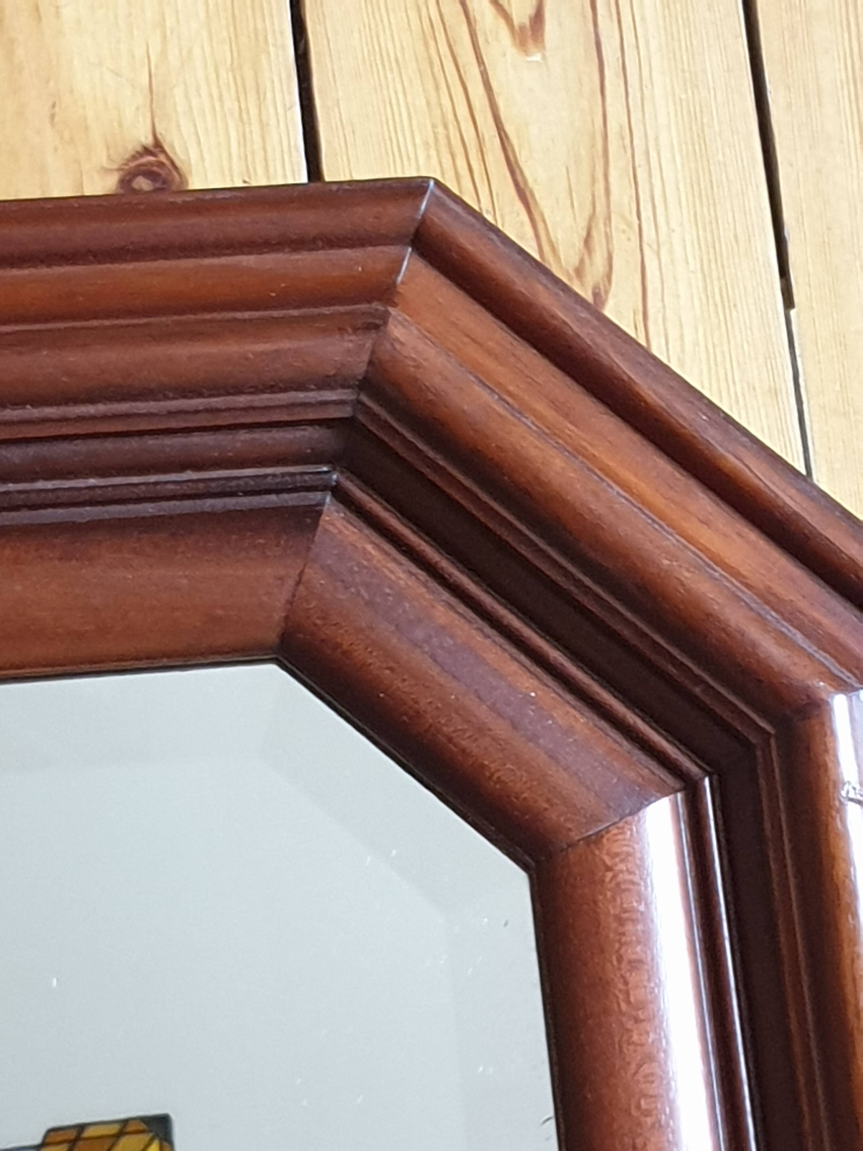 Large beveled mirror in cherry wood frame