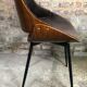 Scandinavian style chairs in curved plywood covered with brown fabric