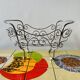 Metal doll's bed on vintage casters