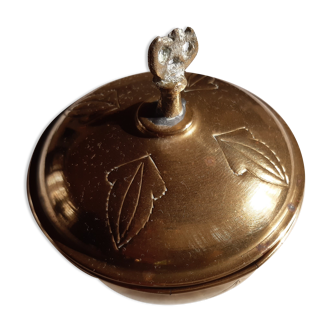 Empty pocket with copper or brass lid. Eagle at the top.
