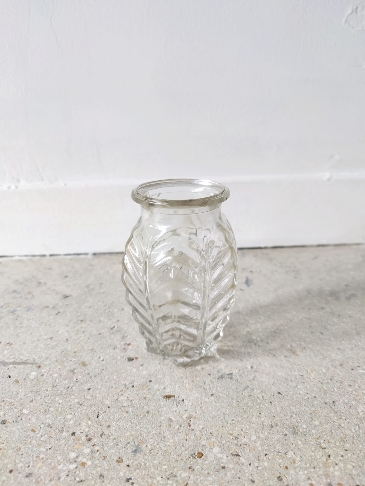 Small transparent molded glass vase