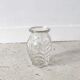 Small transparent molded glass vase