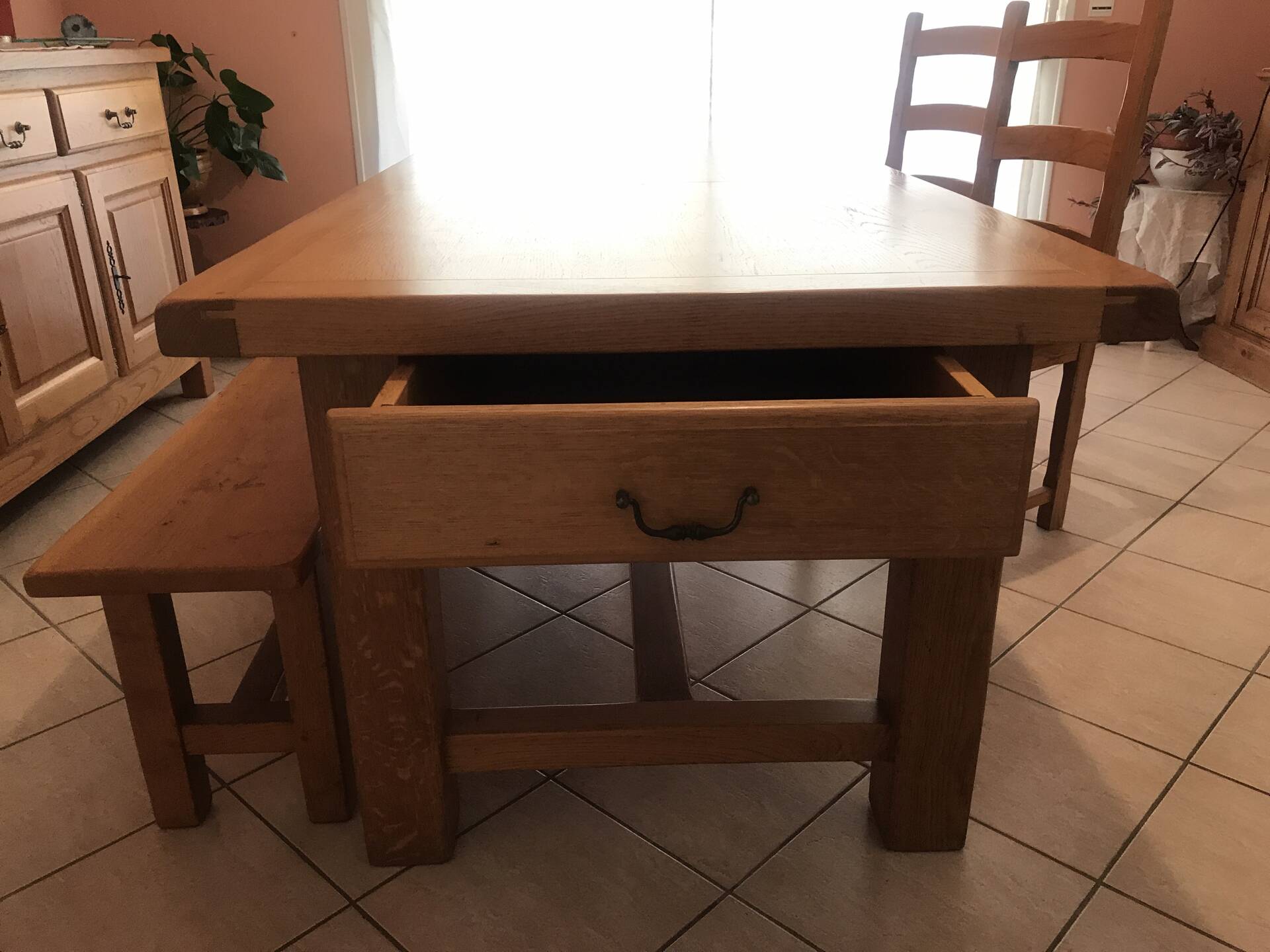 Solid oak dining table made by a craftsman cabinetmaker.