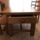 Solid oak dining table made by a craftsman cabinetmaker.
