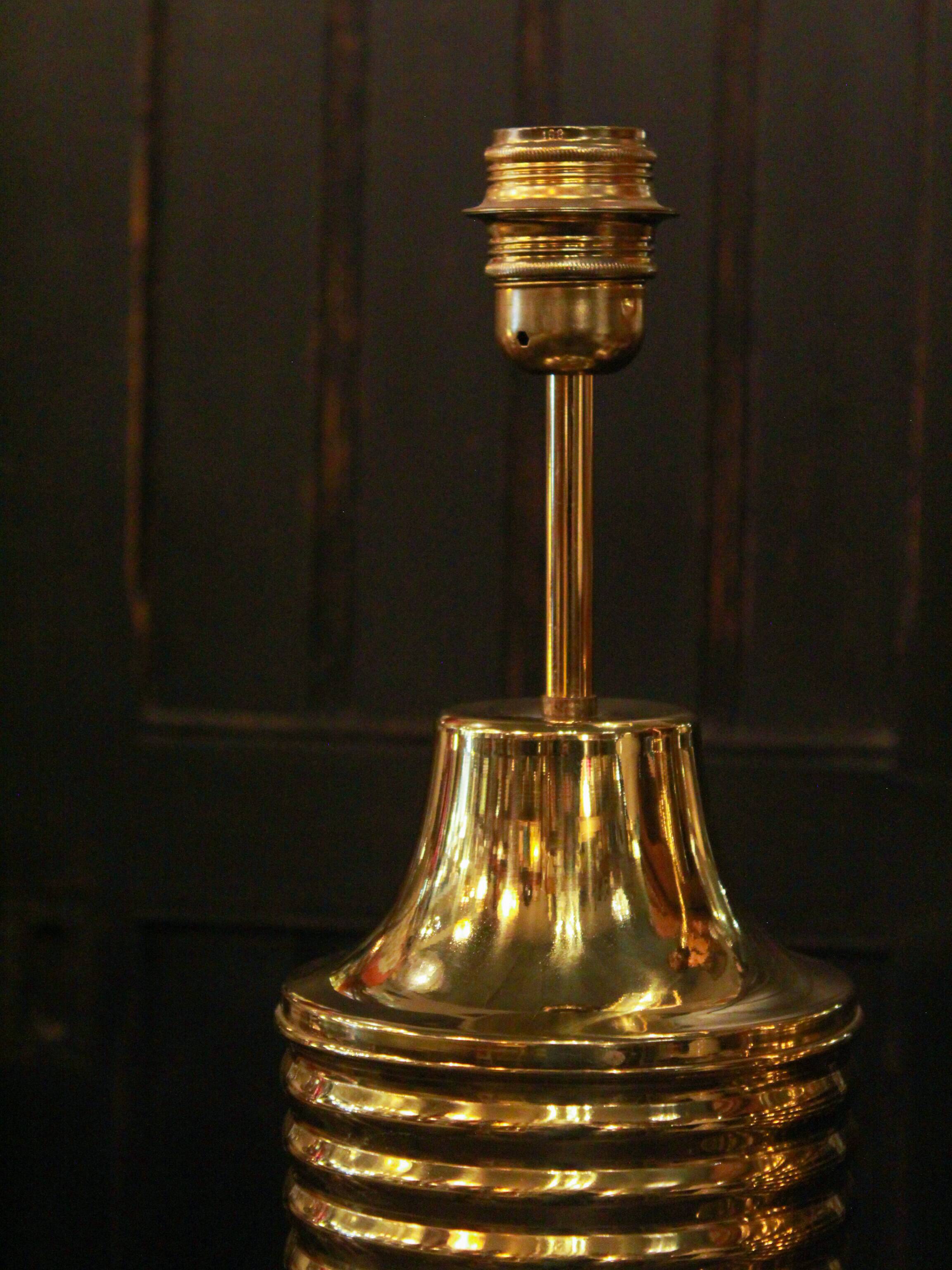 Pair of lamps in gilded brass