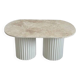 Oval coffee table in travertine and white fluted wood.