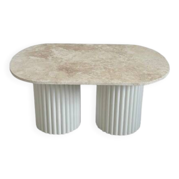 Oval coffee table in travertine and white fluted wood.