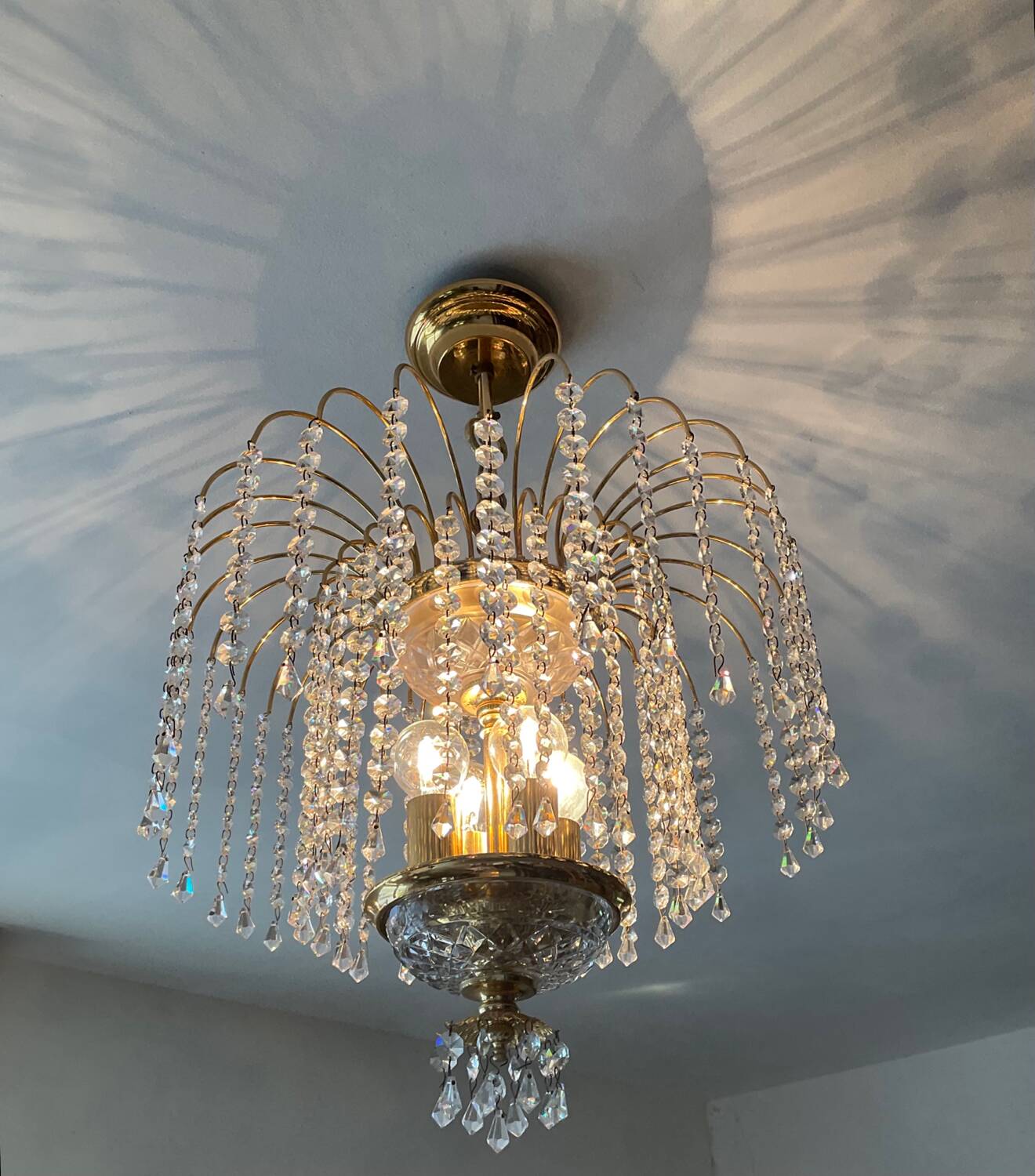 Brass waterfall chandelier with crystal tassels