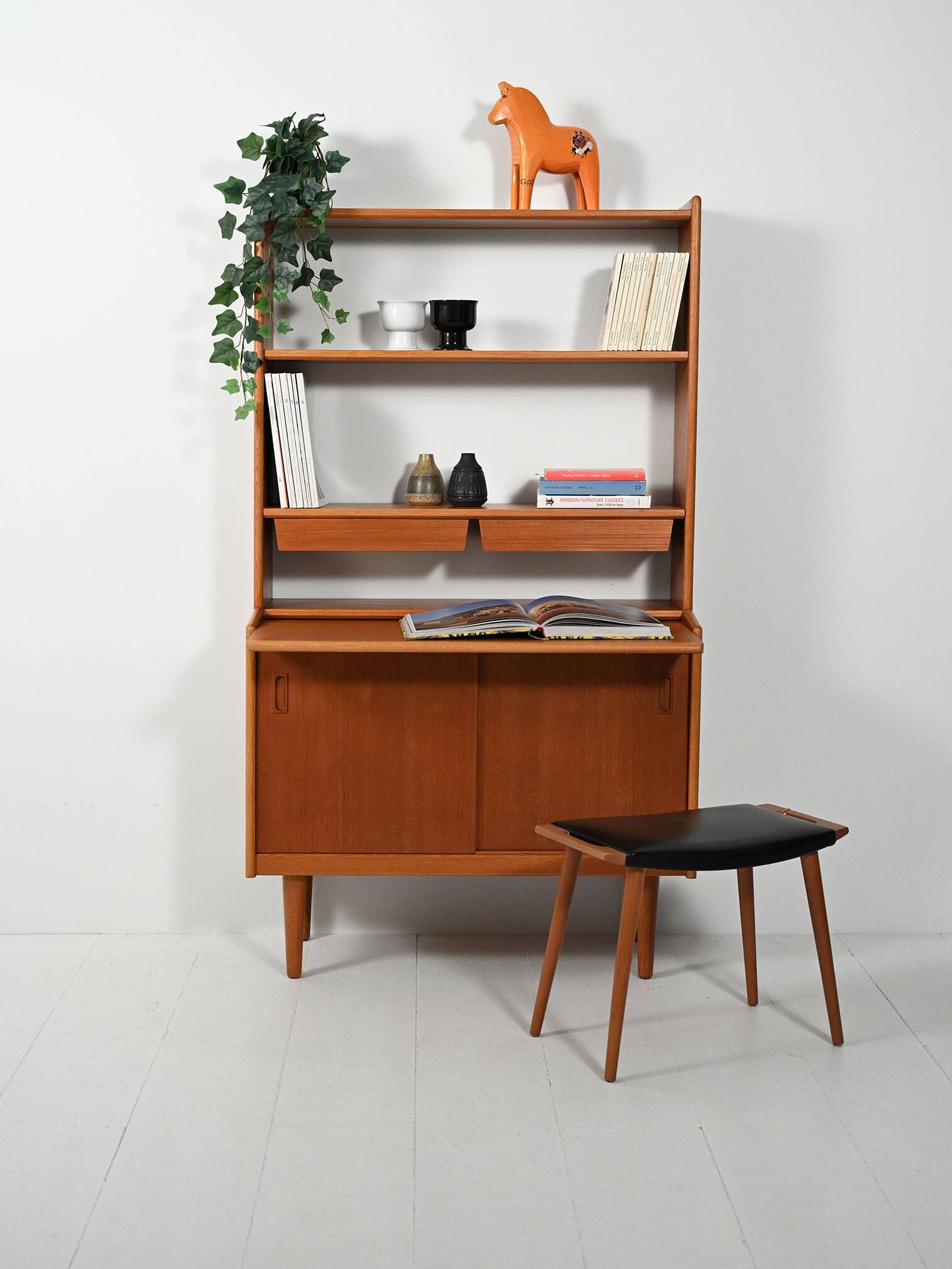 Scandinavian teak bookcase with suspended drawers