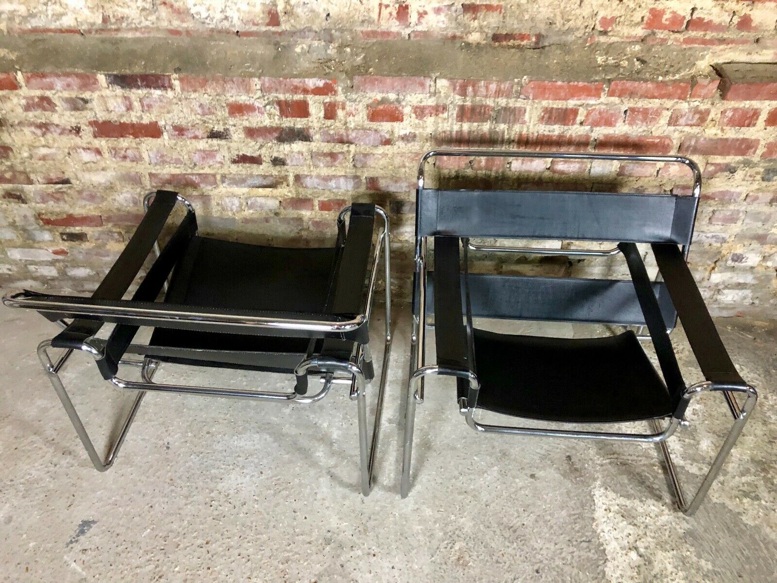 Pair of Marcel Breuer's Wassily armchairs in stainless steel and 60's leather