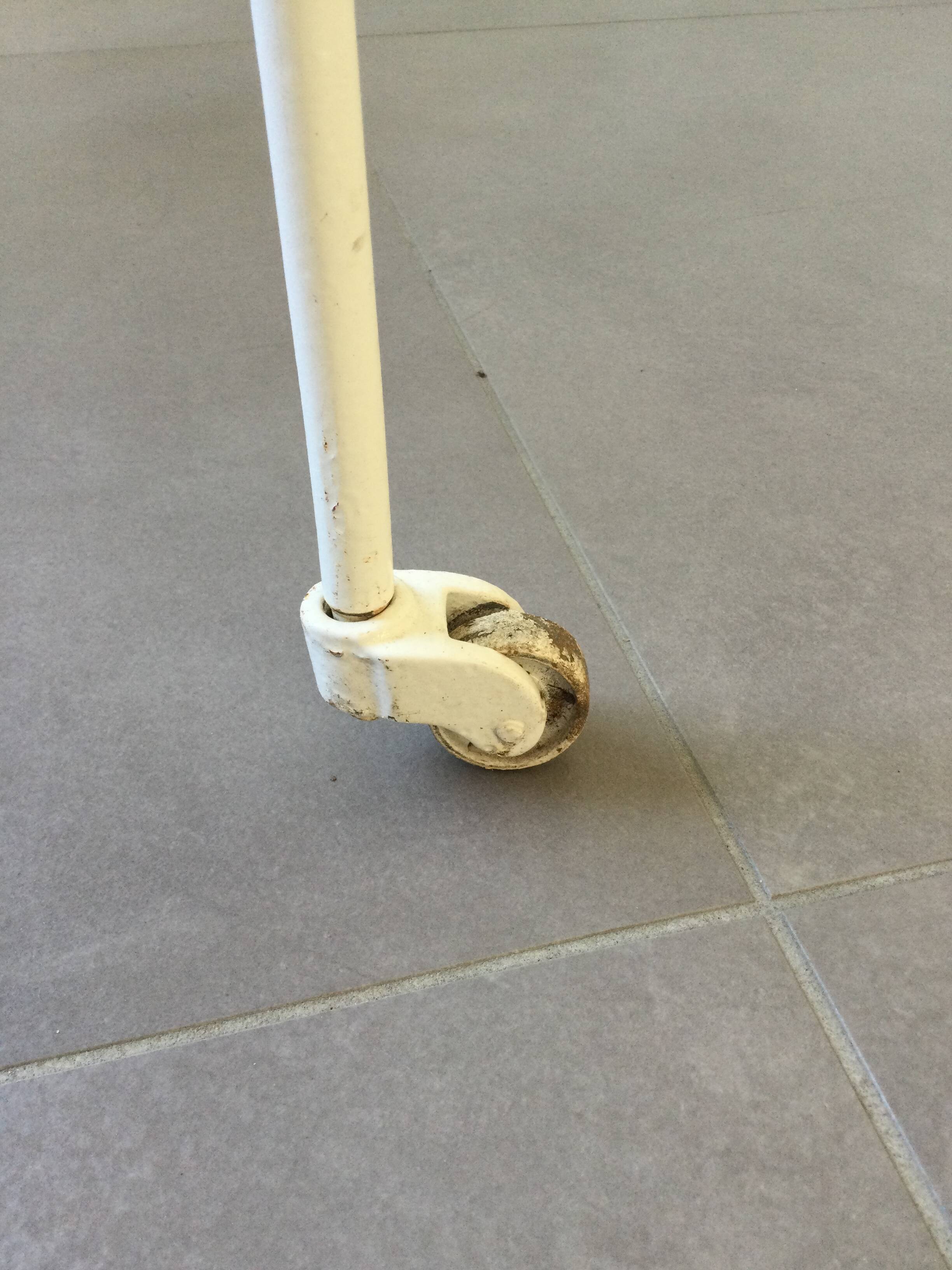 White wrought iron folding bed