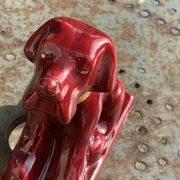 Dog sign CAB in vintage burgundy red enameled ceramic slip, art deco
