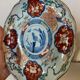 Imari porcelain plate from Japan, 19th century, hand-painted decoration.