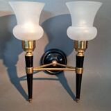 Pair of two-light torchiere wall lights in black lacquered metal and gilded brass, Circa 1960.