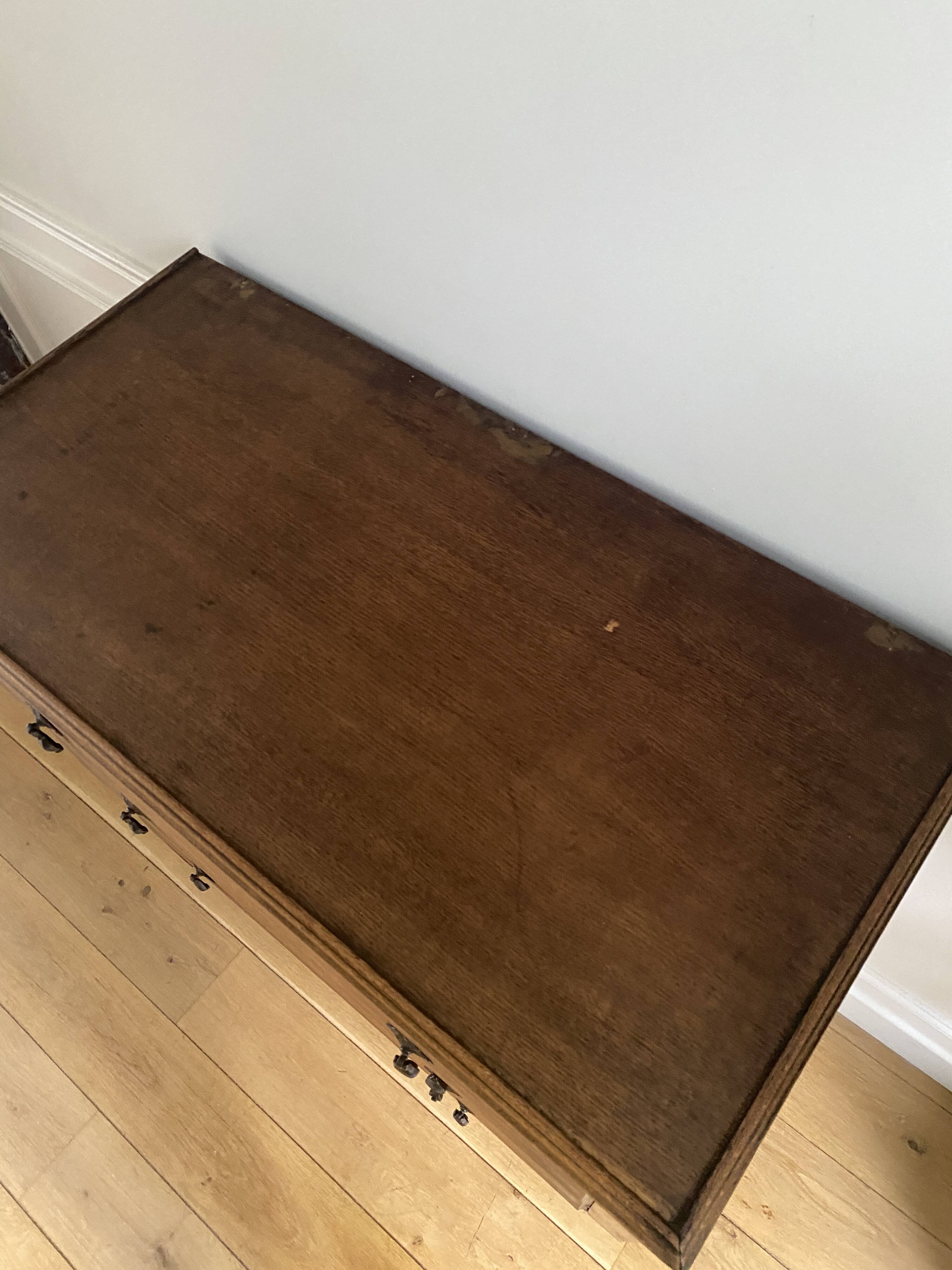 Vintage wooden chest of drawers with three drawers and brown marble top