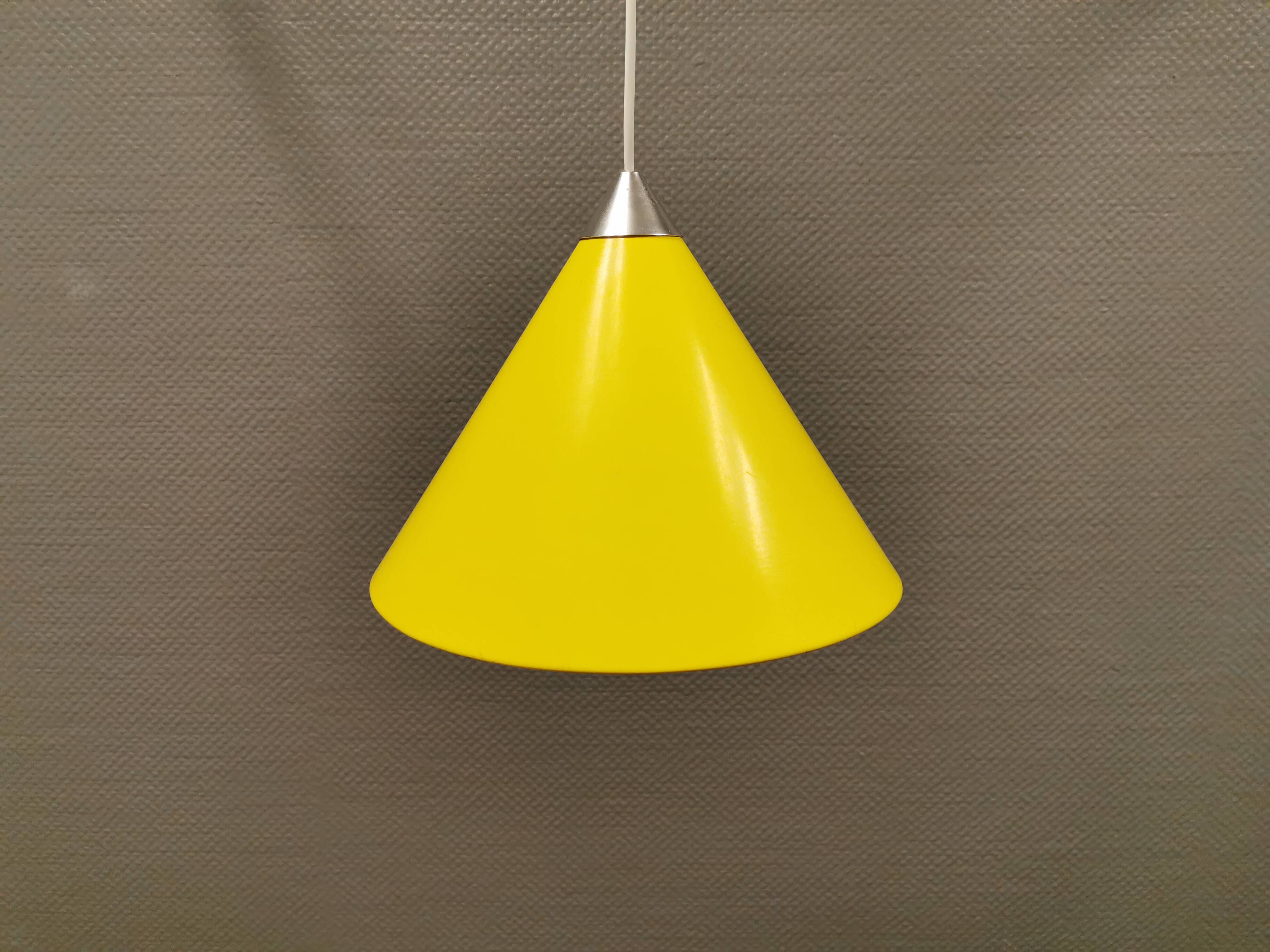 Small cone-shaped lamp in beautiful yellow lacquer finish.