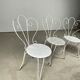 4 vintage wrought iron chairs
