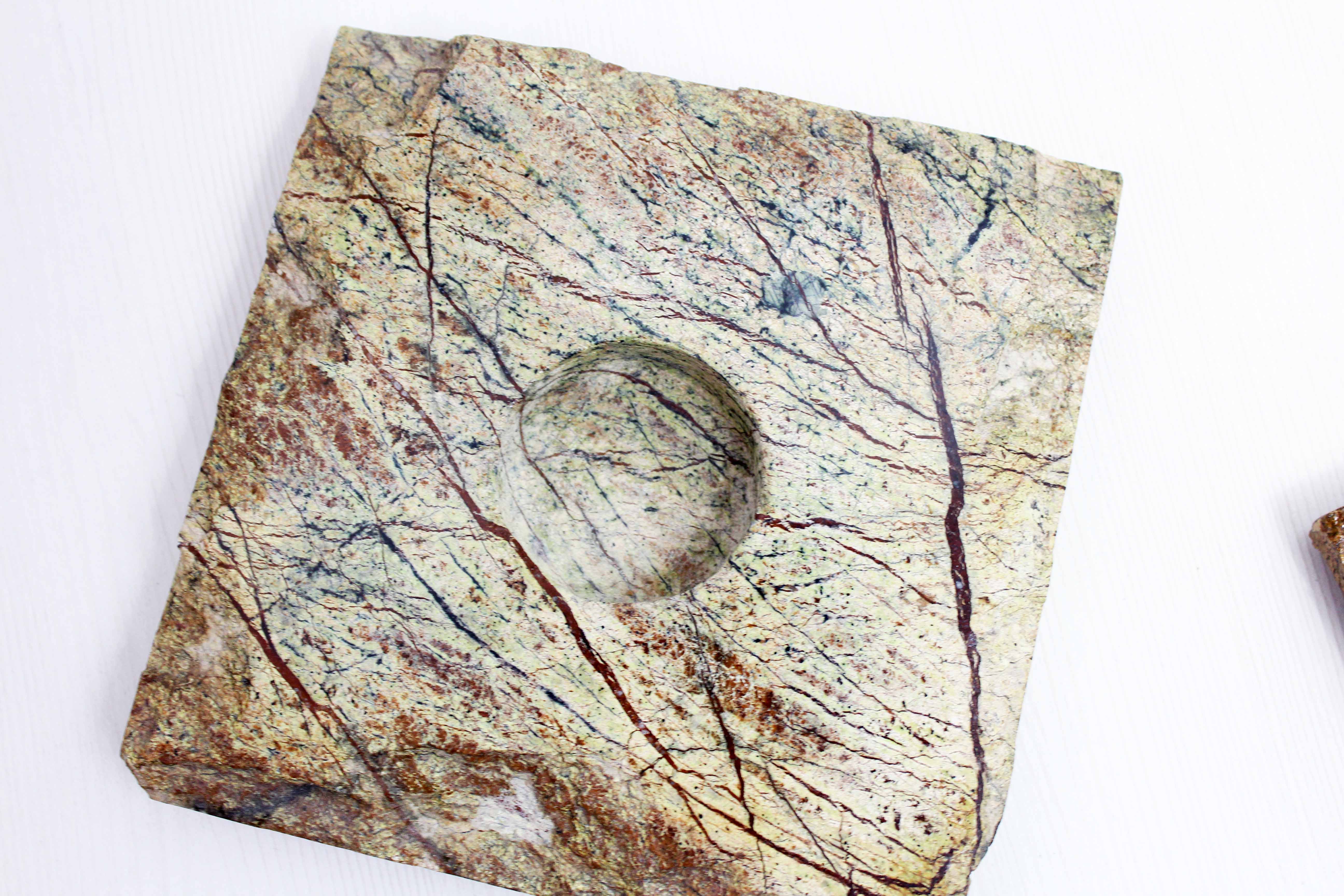 Pair of brutalist travertine candle holders