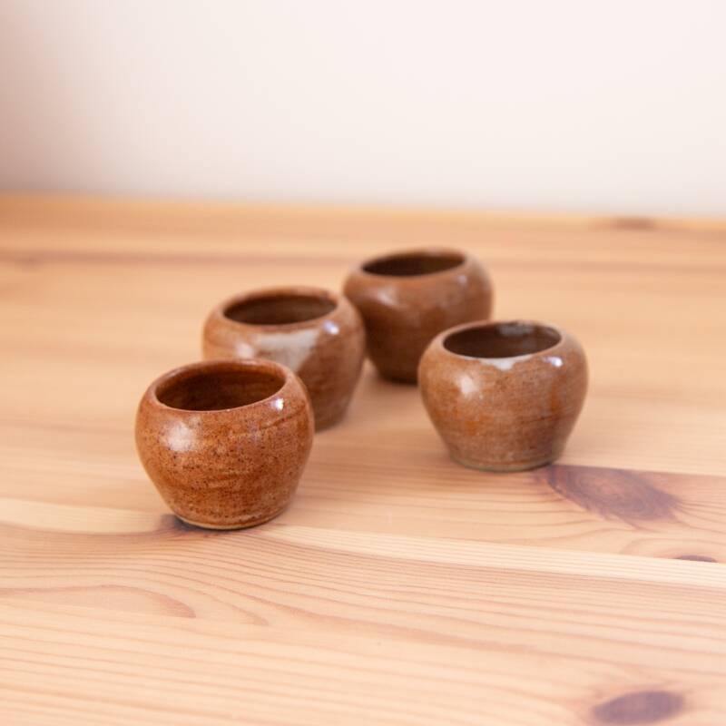 4 brown stoneware candle holders