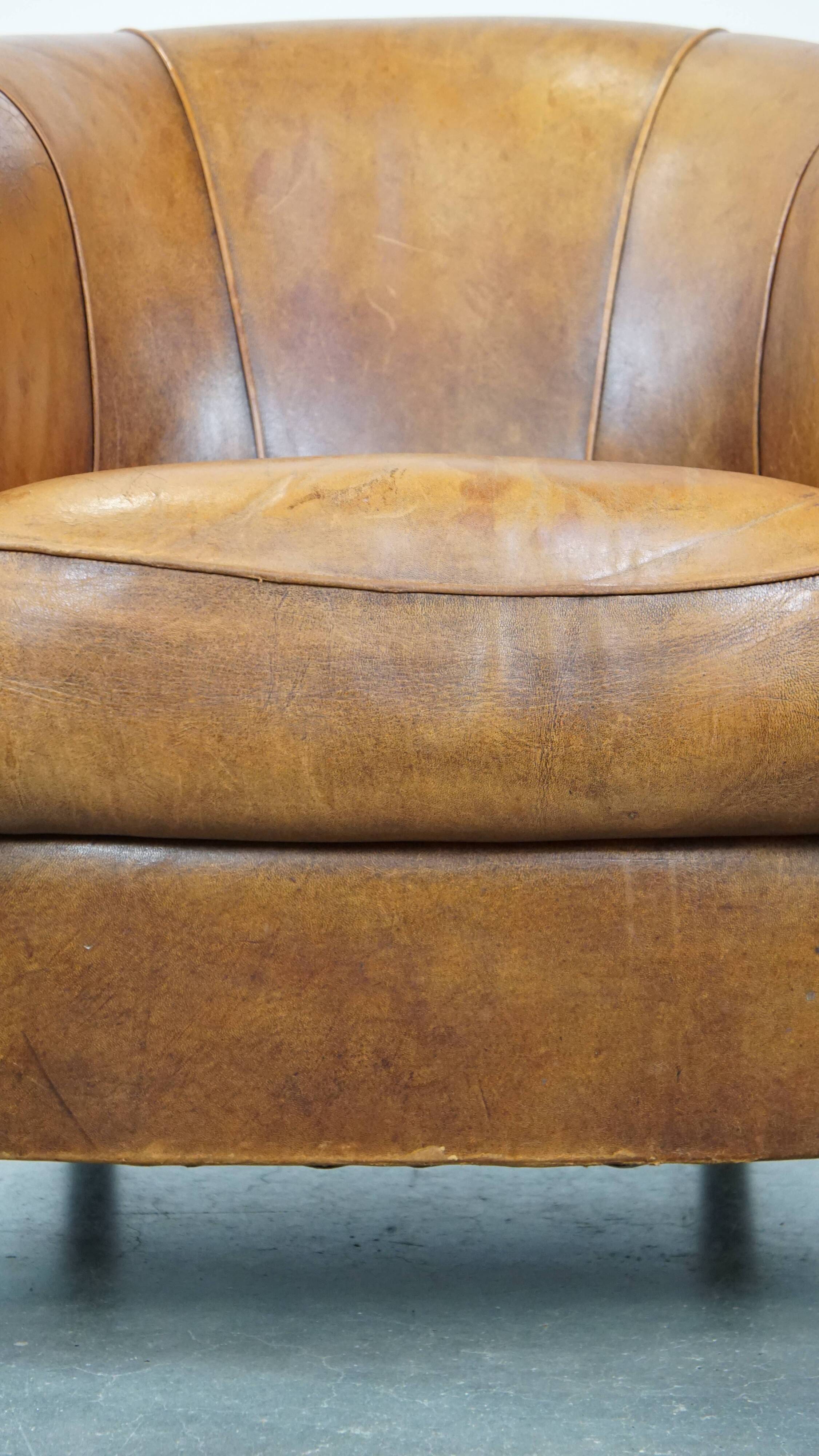 Cognac-colored sheep leather club chair with patina